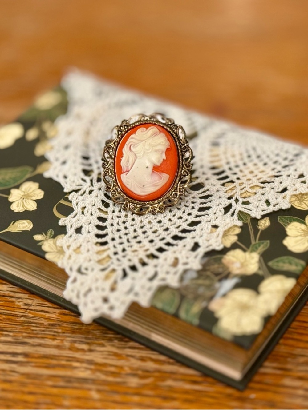 Orange Cameo Brooch with White Profile in Ornate Metal Frame